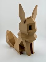 Rich brown low-poly 3D-printed Eevee coin bank, standing 23.5 cm tall with a distinct, angular design and a coin slot and removable cap at the bottom, perfect for Pokémon fans.