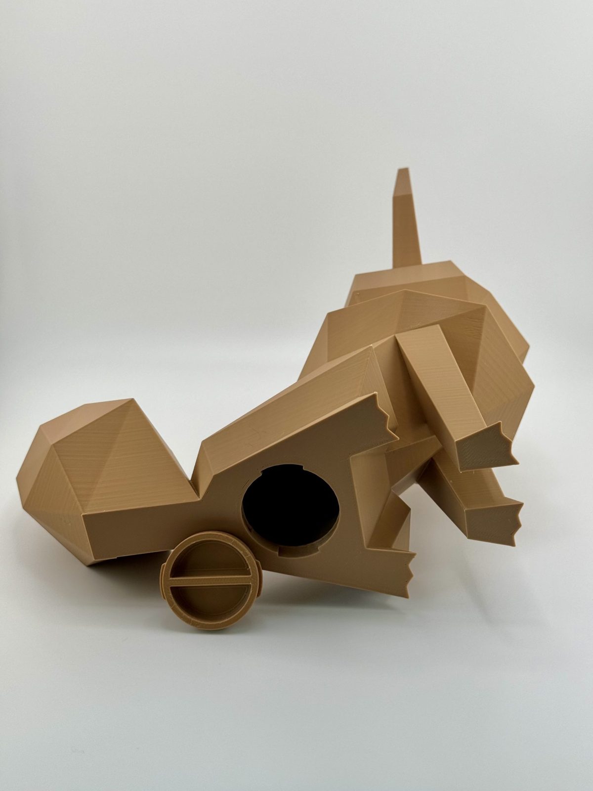 Rich brown low-poly 3D-printed Eevee coin bank, standing 23.5 cm tall with a distinct, angular design and a coin slot and removable cap at the bottom, perfect for Pokémon fans.