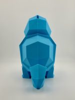 Light blue low-poly 3D-printed Squirtle coin bank, standing 19.5 cm tall with a coin slot, inspired by the classic water-type Pokémon.