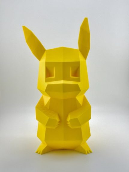 Low-poly 3D-printed Pikachu coin bank in vibrant yellow color, standing upright with a coin slot on the back