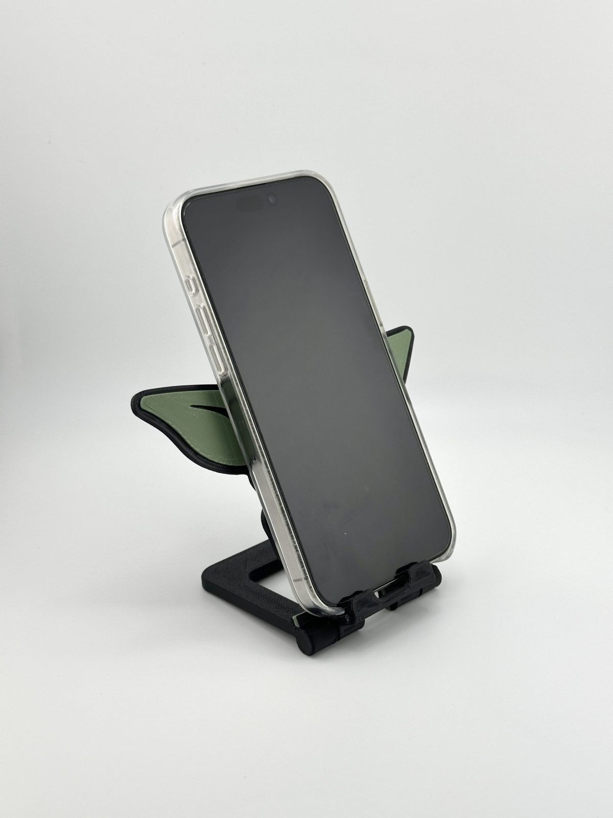 Compact foldable phone stand featuring a multi-color Yoda design, inspired by Star Wars, perfect for supporting smartphones and small tablets.