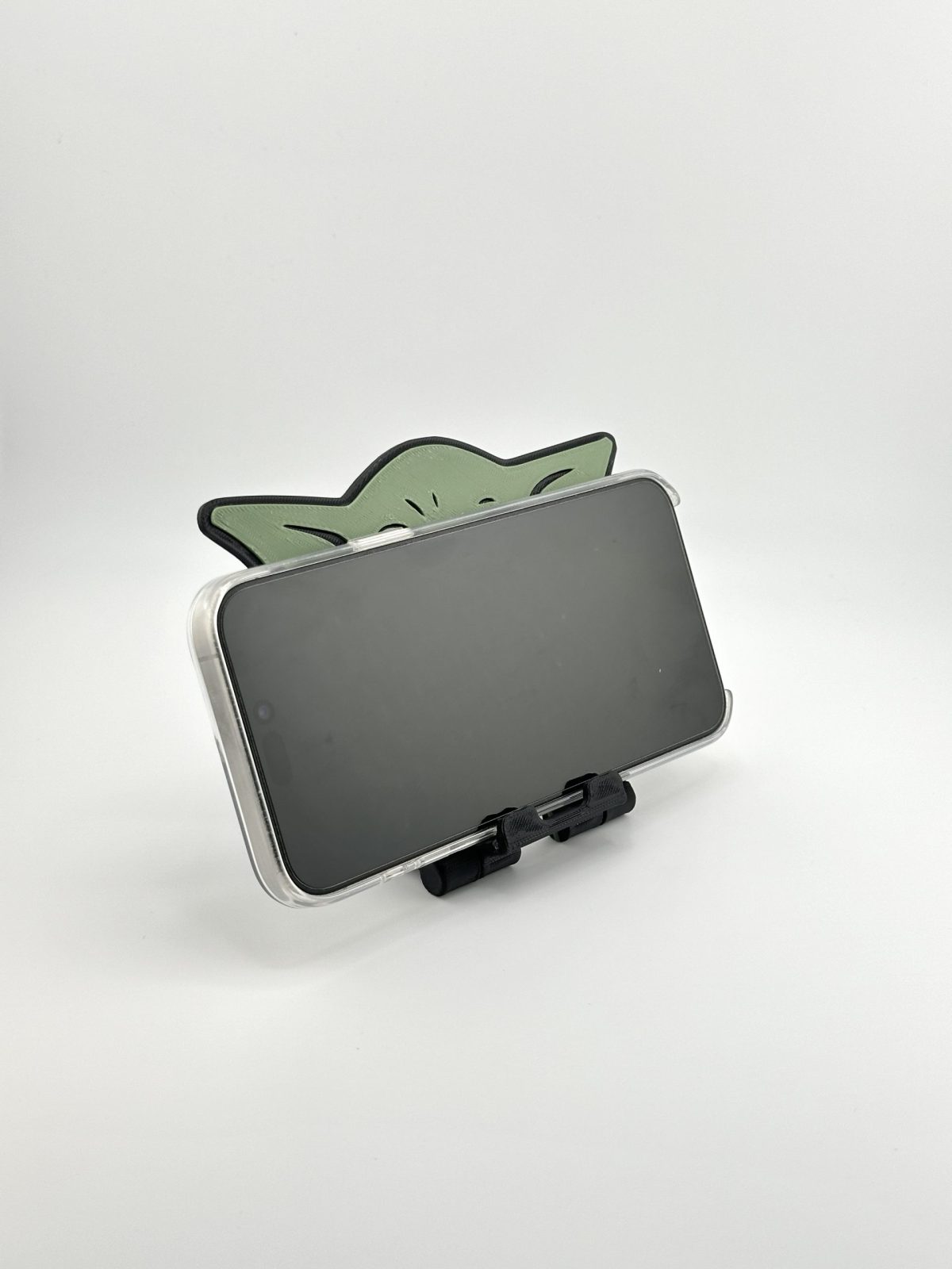 Compact foldable phone stand featuring a multi-color Yoda design, inspired by Star Wars, perfect for supporting smartphones and small tablets.