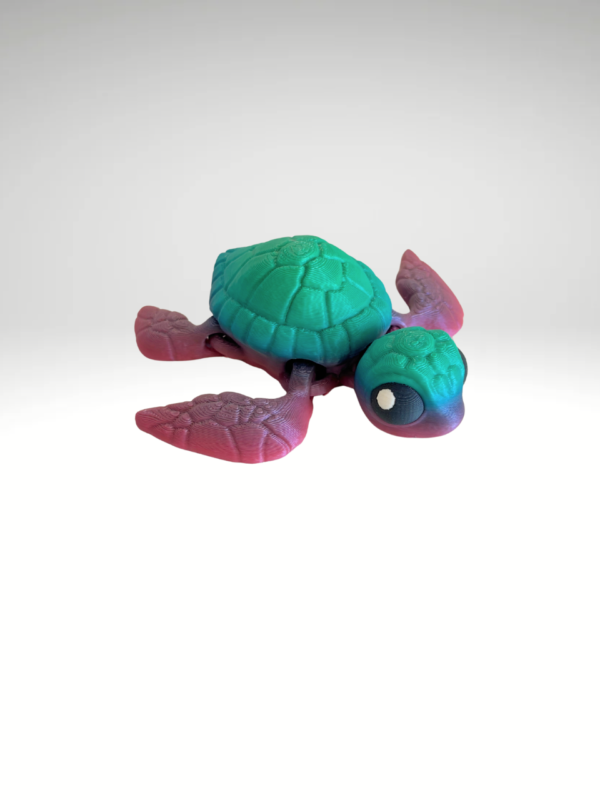 3D-Printed gradient-colored-turtle-with-a-bright-rainbow-shell-set-on-a-neutral-surface.