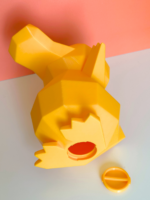 Low-poly 3D-printed Psyduck coin bank in vibrant yellow color, standing upright with a coin slot on the back