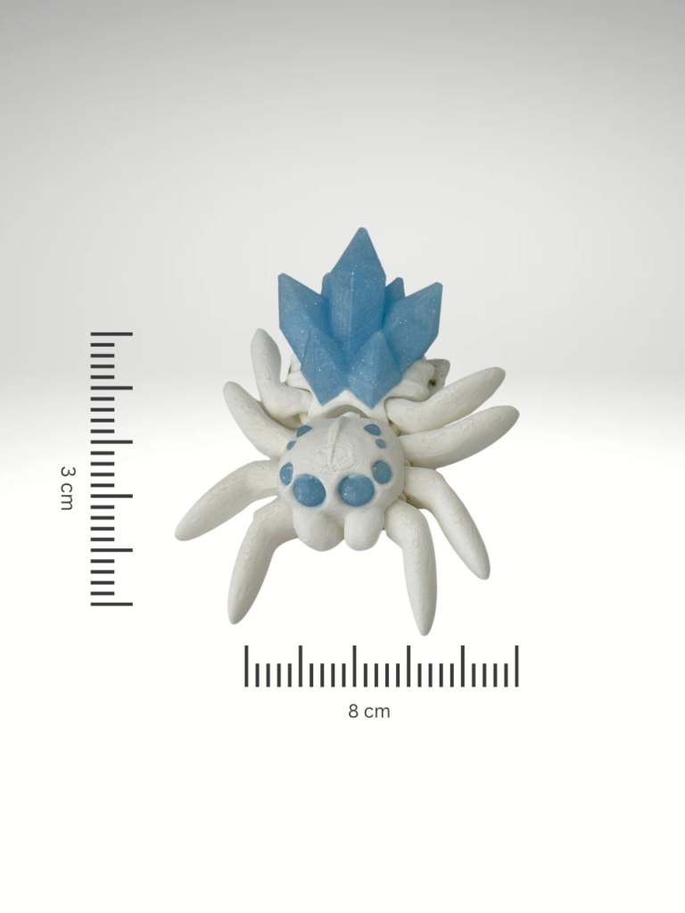 A-3D-printed-crystal-spider-figurine-in-blue-and-white-with-intricate-details-and-a-translucent-gem-like-appearance.