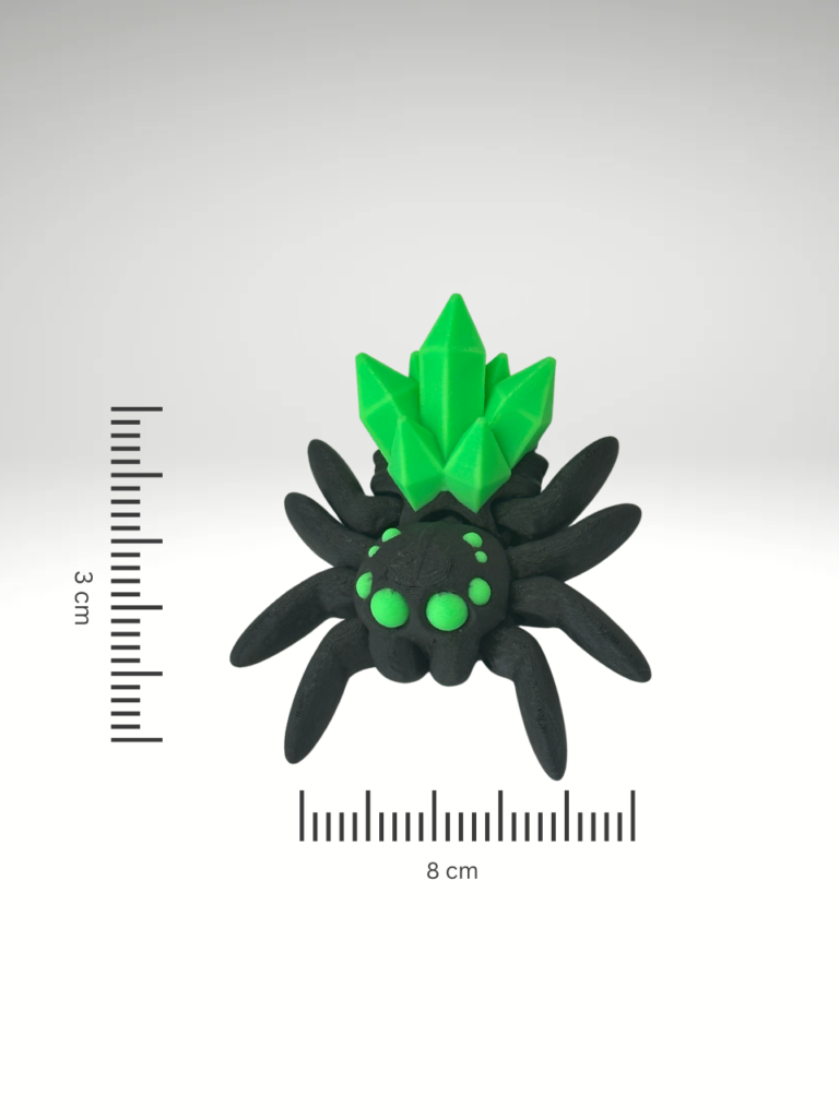 A-3D-printed-crystal-spider-figurine-in-black-and-green-featuring-intricate-details-and-a-translucent-gem-like-finish.