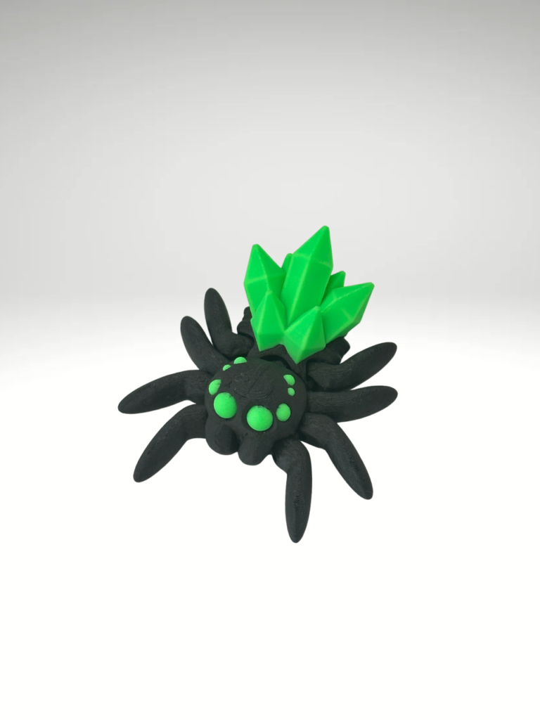 A-3D-printed-crystal-spider-figurine-in-black-and-green-featuring-intricate-details-and-a-translucent-gem-like-finish.